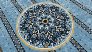 Motif medalion khas karpet custom-made Masjid Kampung Kuantan dengan corak biru, hitam dan emas